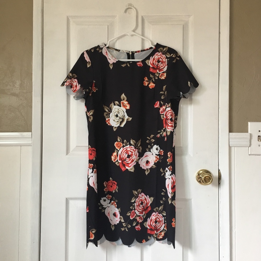 *SOLD ELSEWHERE. Black dress w/ scalloped hems